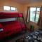 Third Bedroom with double bed with single over top and additional single than can slide under bed if not needed